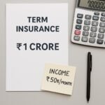 Flat-lay image of a ₹1 crore term insurance document, calculator, and income note showing ₹50K/month — used to represent income-based life cover planning.