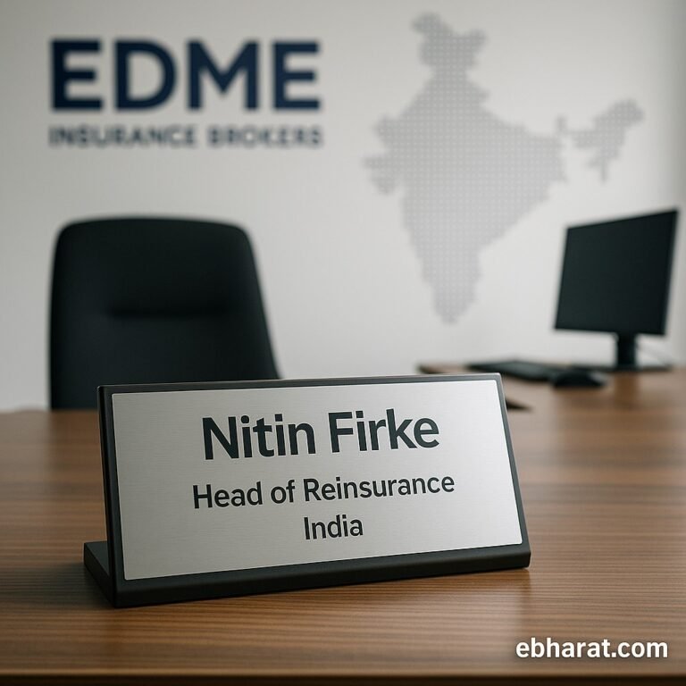Office setup with nameplate of Nitin Firke as Head of Reinsurance at EDME Insurance Brokers, India.